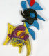 A close up of two different colored pins