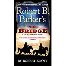 A book cover with two men riding horses.