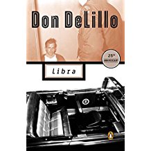 A black and white photo of a suitcase with the words don delillo in front.