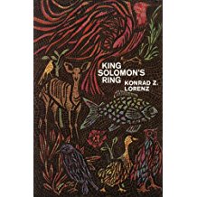 A book cover with animals and trees