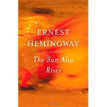 A book cover with an orange background and the title of ernest hemingway.