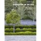 A book cover with trees and bushes in the background.