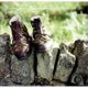 A pair of shoes sitting on top of rocks.