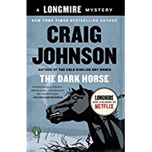 A book cover with a black horse and the words " longmire "