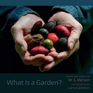 A person holding fruits in their hands with the words " what is a garden ?" written on top of them.