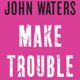 A pink square with the words " john waters make trouble ".