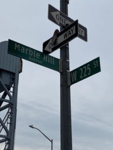 A street sign with two different names on it.