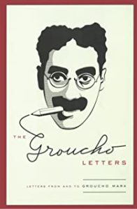 A drawing of groucho marx with a cigarette in his mouth.