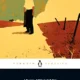 A penguin book cover with a person standing in the grass.