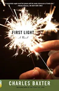 A person holding sparklers with the words " first light " written on them.