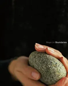 A person holding a rock in their hand.