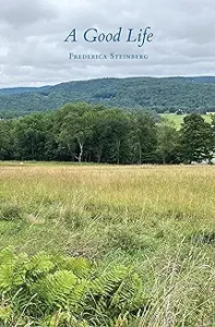 A field with trees in the background and some grass